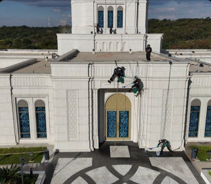 Team on the entrance façade